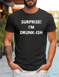 This t-shirt features a humorous and playful slogan that reads "Surprise, I'm Drunkish" in bold, eye-catching letters. Perfect for social gatherings, parties, or casual outings, this shirt adds a fun twist to your wardrobe. Whether you're the life of the party or just looking to bring a smile to others, this t-shirt is a great conversation starter and a stylish addition to your collection. PRODUCTION TIME: 1-3 days (Usually 2 days) SHIPPING TIME: 2-5 days (Usually 3 days) PRODUCT DESCRIPTION: Super soft material. Relaxed fit. Unisex sizing.  For tight fit go down one size; for a relaxed fit order your size; for an oversized look, size up 1-2 sizes. 60% combed ringspun cotton, 40% polyester jersey CARE & WASH INSTRUCTIONS -Machine Wash Cold -Machine Dry Low -Turn Inside Out -Do Not Iron Dir Bourbon Shirts, Alcohol Humor, Drinking Party, Social Gathering, Great Conversation Starters, Party Shirts, Bourbon, Gender Neutral, Relaxed Fit