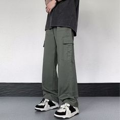 Our Casual Literary Straight Cargo Pants are an essential piece for any stylish look. Boasting a sophisticated solid color and deep pocket detail, these premium pants are the perfect balance of casual and literary. Ideal for any occasion, you'll feel both comfortable and confident in these urban-chic trousers. Features: -100% Cotton -Mid-rise waist -Solid Color -Straight Leg -Regular Fit -Casual style Urban Wide-leg Pants With Pockets, Solid Wide Leg Pants With Pockets For Streetwear, Solid Straight Leg Cargo Pants For Streetwear, Solid Wide Leg Cargo Pants With Patch Pockets, Wide Leg Cargo Jeans With Patch Pockets, Solid Color Relaxed Fit Cargo Pants, Relaxed Fit Solid Cargo Pants, Green Wide-leg Cargo Pants With Patch Pockets, Solid Color Baggy Trousers Work Pants