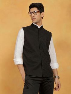 VASTRAMAY Men's Black Cotton Nehru Jacket Elevate your style with the VASTRAMAY Men's Black Cotton Nehru Jacket. Crafted with precision and designed for elegance, this jacket combines tradition with modern sophistication. Whether it's a formal event or a casual outing, this versatile piece will add a touch of refinement to your ensemble. Features: Classic Nehru collar design High-quality cotton fabric for comfort Button closure for a sleek look Two front pockets for convenience Available in vari Semi-formal Classic Nehru Jacket With Stand Collar, Festive Black Business Blazer, Traditional Tailored Black Blazer, Tailored Black Nehru Jacket For Workwear, Semi-formal Nehru Jacket With Stand Collar, Classic Black Bandhgala For Work, Classic Fitted Black Nehru Jacket, Black Stand Collar Blazer For Semi-formal Occasions, Black Semi-formal Blazer With Stand Collar