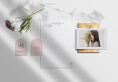 an assortment of business cards and stationery with flowers