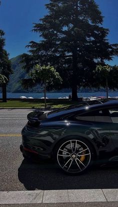 a black sports car parked on the side of the road