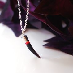 Blood filled glass vampire vial necklace in the shape of a fang.  Perfect gift idea and accessory for vampires, witches and goths!  Looks gorgeous on. - Comes on a silver necklace or an adjustable choker with sliding knots to fit any size - Vial approximately 35mm long - No extra postage cost on multiple items from my shop Grossed out? Don't worry, although the fluid inside is thick and dark red, perfectly resembling blood, it is made with fake blood. :) Please note, the vial is sealed and not i Halloween Jewelry Gift With Claw Shape, Halloween Claw-shaped Jewelry Gift, Halloween Gift Jewelry With Claw Shape, Handmade Vampire Style Necklace For Gift, Gothic Claw Jewelry Gift, Gothic Claw Shaped Jewelry Gift, Gothic Claw Jewelry For Gifts, Vampire Pendant, Blood Vial Necklace