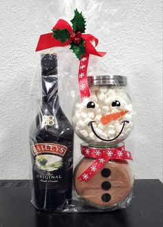 a bottle of booze and a snowman made out of marshmallows