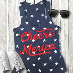 CHEERS MERICA Blue Stars Tank Top with Red Print Celebrate this 4th of July in this Patriotic AF Cheers Merica Tank Top! Sizes: XS, S, M, L, XL, 2XL Measure yourself, and use the size charts provided to determine the best size for you. Cotton Blend Super Soft and Comfy Summer Crew Neck Top With Star Print, Red Star Print Top For Summer, Patriotic Crew Neck Top For Summer, Patriotic Blue Tops For Summer, Cotton Summer Top With Star Print, Blue Patriotic Tops For Summer, Blue Patriotic Summer Tops, Blue Star Print Summer Tops, Blue Star Print Tops For Summer