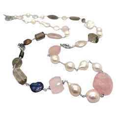 Indulge in the enchanting allure of our Multi-Hued Pearls Baroque and Keshi Pearls and Smoky and Rose Quartz Necklace in Sterling Silver. Each pearl, ranging in exquisite hues, is meticulously selected to create a harmonious blend of colors, complemented by the soft elegance of smoky and rose quartz. Crafted with meticulous attention to detail, this necklace exudes timeless sophistication and adds a touch of refined luxury to any ensemble, making it a must-have statement piece for those who appr Stephen Dweck, Bold Statement Necklaces, Baltic Amber Necklace, Antique Fashion, Silver Choker Necklace, Artisan Bracelets, Rose Quartz Necklace, Kesha, Silver Choker