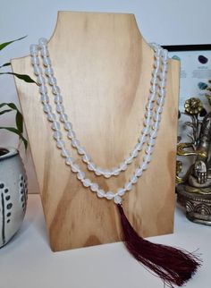 A handmade beautiful White Jade Stone Meditation Mala, Healing necklace, Prayer Beads in 8/10 mm size of beads with blue or maroon color silk tassel. White Jade is a gemstone that holds a lot of meaning and plenty of healing properties, mostly known in her ability to increase or enhance the energy of love in your life, healing, making one feeling peaceful and calm. White Jade is a kind of Tremolite Jade witch is a variety of Nephrite, that's usually white, off-white, or cream in color. The neckl Spiritual White Beaded Necklace With Faceted Beads, White Spiritual Beaded Necklace With Faceted Beads, White Faceted Spiritual Beads, White 8mm Bohemian Beads, Bohemian White Crystal Necklaces With Round Beads, White Hand-strung Beaded Necklaces, White Gemstone Beaded Necklaces For Meditation, White Hand-strung Round Beaded Necklaces, White Hand-strung Beaded Necklaces With Round Beads