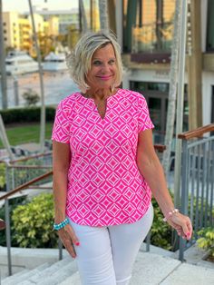 92% Nylon / 8% Spandex. Cathy is wearing a size medium V-neck short sleeve shirt. 3/4 sleeve. UPF50+ sun protection fabric. Silky feel. Straight hemline. Pre-shrunk. Center back length: 24 1/2 inches. Machine wash Online and in stores. Summer Tops With Upf 50+ And Stretch, Summer Stretch Tops With Upf 50+, Sporty Summer Tops With Upf 50+, Sporty Pink Tops For Vacation, Sporty Pink Top For Vacation, Sporty V-neck Beach Tops, Sporty Short Sleeve Tops With Upf 50+, Casual Short Sleeve Tops With Upf 50+, Stretch Short Sleeve Tops With Upf 50+