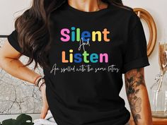 Teacher Shirt 'Silent and listen are spelled with the same letters' quote.  The perfect gift for a teacher or student teacher. Start your classroom management by wearing this cozy shirt to school.   Embrace positivity and mindfulness with this colorful Silent Listen Typography T-Shirt. Perfect for casual wear and spreading good vibes, this t-shirt features an inspirational quote that reminds us of the power of silence and listening. It's a great addition to your wardrobe or a thoughtful gift for Funny Teacher Shirts, The Power Of Silence, Power Of Silence, Education Shirts, Student Shirt, Funny Teacher Gifts, Shirt Sayings, Typography T Shirt, Funny Shirt Sayings