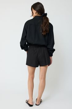 The wool bomber jacket features a slight oversized silhouette crafted of a lightweight wool fabric. Relaxed dropped-shoulder sleeves and a bubble hem define the look. It has a spread collar with ribbed cuff sleeves. Pair it back to the midi skirt or cargo trousers. Black Cropped Jacket With Ribbed Cuffs, Fall Workwear Tops With Elastic Cuffs, Chic Long Sleeve Cropped Jacket With Relaxed Fit, Elastic Cuffs Tops For Workwear In Fall, Fall Workwear Outerwear With Blouson Sleeves, Spring Cropped Jacket With Ribbed Cuffs And Long Sleeves, Cropped Long Sleeve Jacket With Ribbed Cuffs For Spring, Casual Cropped Long Sleeve Jacket With Ribbed Cuffs, Chic Outerwear With Blouson Sleeves For Work