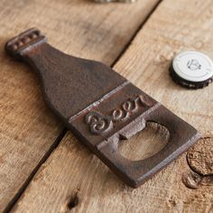 a bottle opener sitting on top of a wooden table