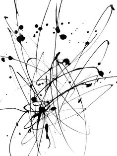 black ink splattered on white paper with lines and dots in the center, forming an abstract pattern