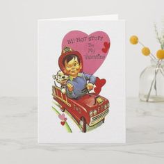 a valentine card with an image of a boy in a firetruck holding a dog