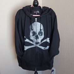 Dollskill Trickz N Treatz Black Long-Sleeved Zip Hoodie With Skull On Front 1x This Is Very Oversized Im 2x And This 1x Is Big On Me This Is Just My Opion Cotton Hoodie With Skull Print, Black Skull Print Sweatshirt For Winter, Alternative Style Skull Print Hoodie, Alternative Long Sleeve Hoodie With Skull Print, Casual Skull Print Hoodie Outerwear, Alternative Skull Print Sweatshirt For Fall, Alternative Style Skull Print Sweatshirt For Fall, Black Cotton Sweatshirt With Skull Print, Edgy Skull Print Sweatshirt For Winter