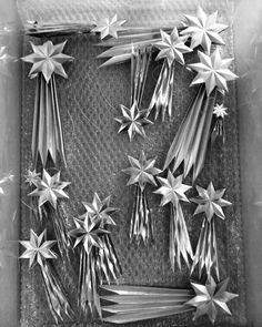 there are many silver stars on the tray