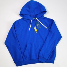 This Is A New With Tags Polo Ralph Lauren Boy’s Hoodie In Size M. It Is Blue With A Yellow Embroidered Polo Logo On The Left Chest. The Hoodie Has A Kangaroo Pocket And A Drawstring Hood. The Fabric Is A Soft Cotton Blend. Size M, Please Review All Measurements To Confirm Fit. The Hoodie Is In Excellent Condition With No Visible Imperfections. It Comes With The Original Tags And Packaging. Affordable Blue Ralph Lauren T-shirt, Polo Logo, Ralph Lauren Boys, Boys Hoodies, Shirts & Tops, Kangaroo Pocket, Kids Shirts, Blue Yellow, Sweater Outfits