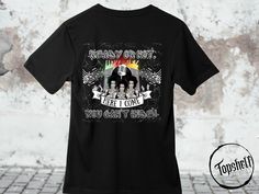 a black t - shirt with an image of the band