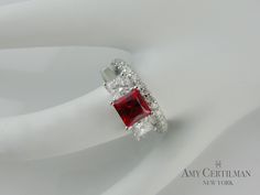 Lab Grown Ruby and Diamond Three Stone Engagement Ring set in 18K White Gold. Our client wanted something clean and modern. We choose this stunning 6x6 princess cut lab ruby and off set with two 4x4 princess cut GVS side stones. Can be made with other stones and sizes. Diamond wedding band sold separately. 2-10 weeks delivery Three Stone Engagement Ring, Stone Engagement Ring, Three Stone Engagement, Three Stone Engagement Rings, Engagement Ring Set, Stone Engagement, Diamond Wedding Band, Engagement Ring Settings, Three Stone