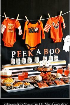 halloween baby shower by to zero's celebration with peekaboo onesie shirts and cupcakes