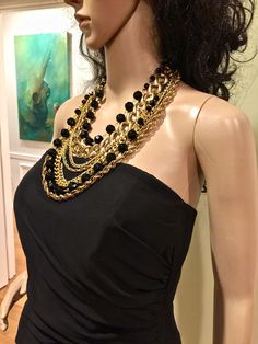 Made in USA. Designed and made by Mirela Skikic Voss - Louisville, KY Elegant, classy, and trendy piece of jewelry for every occasion. Made of several different gold and black color chains, and of glass black beads. It opens/closes behind the neck with a lobster clasp. Excellent gift idea. Black Jewelry With Gold Chain For Evening, Evening Black Jewelry With Gold Chain, Costume Jewelry Necklaces With Beaded Chain For Parties, Black Metal Chain Necklace For Fashion, Costume Jewelry Beaded Chain Necklaces For Parties, Black Multi-strand Jewelry For Evening, Costume Jewelry Party Necklaces With Beaded Chain, Costume Jewelry Beaded Chain Necklace For Party, Trendy Black Jewelry With Gold Chain