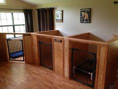 an empty room with wooden floors and dog gates