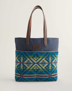 A new tote style with a cotton canvas body, leather straps and two generous front slip pockets crafted from USA-woven Pendleton wool. Cotton-lined interior has one slip pocket. Pattern placement may vary. 13"W x 14"H; 4" base. 11" handle drop. Cotton body with 100% virgin wool pockets; leather straps. Wool fabric woven in our American mills. Imported of USA/imported fabric. | DIAMOND DESERT WOOL/LEATHER MARKET TOTE Desert Market, Tote Design, Pocket Craft, Market Tote Bag, Market Bags, Baby Fabric, Pendleton Wool, Wool Shirt, Market Tote