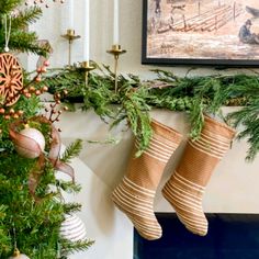 christmas stockings hanging from the fireplace mantel