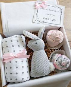 "Welcome the new baby with a sweet little gift box!  Ready to give at a baby shower or to welcome the new little member of the family.  Here is what you'll find inside: *  MUSLIN BABY SWADDLE BLANKET - These soft blankets measure 47\" x 47\", so are perfect not only as a comfy swaddle, but they can also be used as a nursing cover, car seat canopy, large burp cloth, security blanket, stroller cover, etc.! *  STUFFED BUNNY - This is the perfect-sized toy to take in the diaper bag for baby! It measures 7\" tall and 3 1/2\" wide and even rattles when shaken.  So very cute! *  2 BODYSUIT CUPCAKES - Two name-brand onesies (size 0-3 months) \"baked\" into the cutest cupcakes!  If you would prefer a different size, please leave a note at checkout stating what size bodysuits you would like included Nouveau Ne, Newborn Gift Boxes, Baby Blanket Gift, Baby Muslin Swaddle, Stuffed Bunny, Cadeau Baby Shower, Box Baby, Baby Boy Gift, Stroller Cover