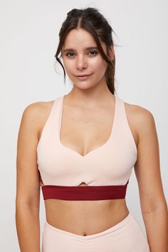 Working out has never felt so good! We designed this bra to provide a medium support for those days that are more Zen. With a stylish strappy back, and mesh contrast sides, this sports bra has a high fashion feel. Uniquely designed for low to medium impact workouts. Removable cups are included for added modesty. Bra Size Charts, Those Days, Pink Bra, Double Knitting, Merlot, Bra Sizes, High Fashion, Zen, Sports Bra