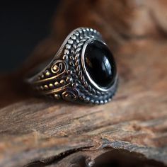 Introducing our Black stone oval onlyx stainless Steel Ring featuring an intricate design and a striking cabochon. This exquisitely crafted piece seamlessly blends timeless elegance with contemporary style. The detailing on the stainless steel band adds a touch of artistry, while the oval onyx stone takes center stage, exuding a sense of mystery and refined charm in the boho hippie style. Whether you're dressing up for a special occasion or adding a touch of intrigue to your everyday look, this Bohemian Oval Metal Rings, Unique Black Stainless Steel Jewelry, Boho Hippie Style, Present For Him, Casual Jewelry, Stainless Steel Ring, Oval Stone, Onyx Stone, Stainless Steel Band