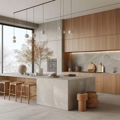 a modern kitchen with marble counter tops and wooden cabinets, along with bar stools