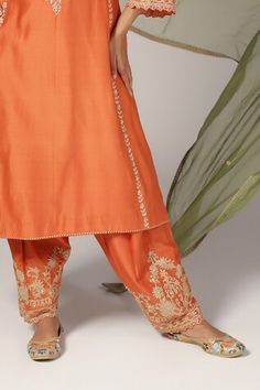 Orange silk chanderi kurta with zari and aari embroidery. Comes with salwar and a green organza dupatta. - Aza Fashions Tussar Silk Palazzo Set With Gota Work For Festivals, Slub Silk Unstitched Suit With Dori Work For Festivals, Festival Tussar Silk Kurta With Dori Work, Floor-length Orange Kurta With Zari Work, Fitted Orange Chanderi Kurta, Semi-stitched Orange Chanderi Salwar Kameez, Embroidered Orange Straight Kurta Set, Semi-stitched Silk Orange Kurta, Salwar Pattern