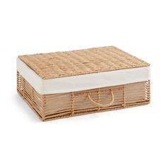 a wicker box with a mattress on top