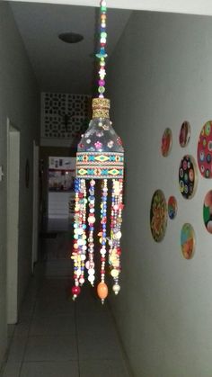 a light fixture hanging from the ceiling in a hallway