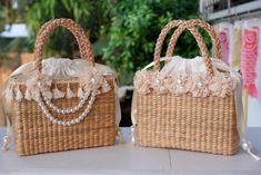 Elegant Beach Bag With Pearl Handle, Elegant Beach Bags With Pearl Handle, Elegant Bucket Beach Bag, Summer Wedding Shoulder Bag With Pearl Handle, Beige Shoulder Bag For Summer Wedding, Summer Wedding Pouch Bag, Summer Gift Straw Pouch Bag, Cream Wedding Bags For Summer, Elegant Natural Color Beach Bag