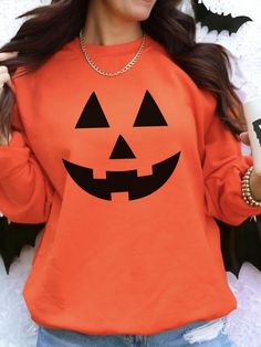 Get into the Halloween spirit with our Jack-O-Lantern Face Unisex Heavy Blend Crewneck Sweatshirt. This vibrant orange sweatshirt features a bold black jack-o-lantern face graphic, perfect for festive fall vibes. Made from a cozy heavy blend fabric, it offers warmth and comfort for cool autumn days. Ideal for pumpkin patch outings or Halloween celebrations. Embrace the season in style! FEATURES: Made with a medium-heavy fabric blend of 50% cotton and 50% polyester (8.0 oz/yd² (271.25 g/m²)), thi Orange Crew Neck Top For Fall, Red Long Sleeve Tops For Halloween, Red Long Sleeve Top For Halloween, Orange Crew Neck Top For Halloween, Orange Crew Neck Sweatshirt For Fall, Red Long Sleeve Sweatshirt For Halloween, Orange Long Sleeve T-shirt For Fall, Spooky Orange Long Sleeve Tops, Red Long Sleeve T-shirt For Halloween