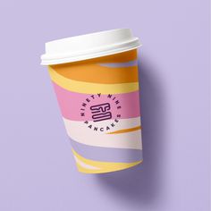 a cup of coffee on a purple background