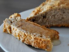 two pieces of bread sitting on top of a white plate