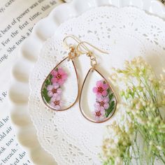 Resin Earrings, Pressed Flowers Earrings, GOLD Filled, Resin jewelry, Natural Jewelry, Teardrop Drop Dangle Earrings, Pink Flower Earrings You will receive PINK earrings. The Pink flowers (Spiraea cantoniensis) are carefully dyed in pink, pressed and put them into crystal resin.  The material of ear wire is 14K GOLD FILLED. Charm Size: tops; 32x23mm Gold plates brass  14K Gold FILLED French Hook Earwire Teardrop Flower Earrings Gift, Teardrop Flower Pierced Earrings Gift, Elegant Teardrop Earrings With Pressed Flowers, Rose Gold Pressed Flower Earrings, Delicate Teardrop Flower Earrings For Pierced Ears, Gold Teardrop Flower Earrings With Pressed Flowers, Delicate Teardrop Flower Earrings, Rose Gold Pressed Flower Drop Earrings, Pink Drop Earrings With Pressed Flowers