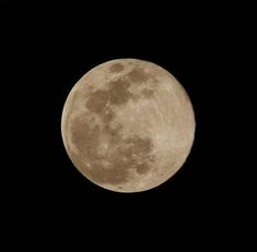 the full moon is seen in the dark sky