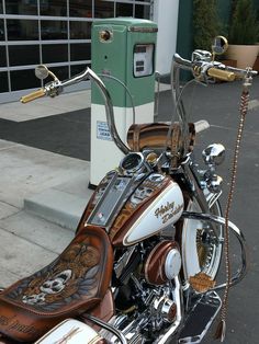 a motorcycle parked next to a parking meter