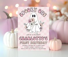 a pink and white birthday card with a ghost holding flowers in front of some pumpkins