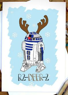 a star wars r2 - d2 christmas card with reindeer antlers on it