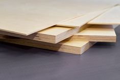 several pieces of plywood are stacked on top of each other in order to be used