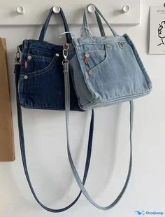 two purses hanging on the wall next to each other