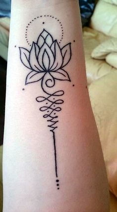 a tattoo on the arm of a woman with a flower in her left hand and an arrow