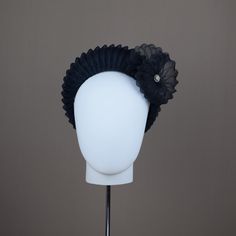 From our UNIQUE COLLECTION this very flattering halo crown style is very much in vogue this season. This one has been hand blocked and wired using traditional millinery techniques. Formed from navy sinamay straw and overlaid with pleated crin.  A sculptural shell and vintage brooch adorns one side. ONE OF A KIND - READY TO SHIP  UK - STANDARD DELIVERY  1-2 DAYS           EXPRESS NEXT DAY  INTERNATIONAL  -STANDARD DELIVERY  5-10 DAYS                                    EXPRESS 3-4 DAYS CHOOSE DELI Formal Adjustable Headband With Handmade Flowers, Adjustable Hair Accessories With Handmade Flowers For Formal Occasions, Formal Hair Accessories With Handmade Flowers, Handmade Flowers Headband For Formal Occasions, Elegant Adjustable Hair Accessories With Handmade Flowers, Elegant Hair Accessories With Handmade Flowers And Adjustable Fit, Formal Hair Accessories With Matching Adjustable Headband, Formal Hair Accessories With Matching Headband, Adjustable Handmade Flower Hair Accessories For Evening