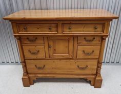 an old wooden dresser with many drawers