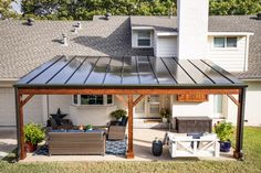 a patio covered with furniture and a metal roof