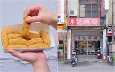 a person holding up food in front of a building and on the other side is a motorcycle