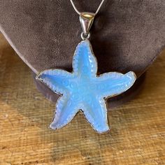 Pretty Remarkable Vintage Acrylic Starfish Charm Surrounded In A .5” Sterling Shaped Band. The Light Blue Colors Radiate Into A Multi Colored Light Catching Sparkler. The Sterling Chain Is 16” Long And Marked As Made In Italy And Stamped As Sterling (925). The Pendant And Bale Measure 3” In Length. With A Thickness Overall Of .5” Ocean-inspired Silver Star Jewelry, Ocean-inspired Star Shaped Silver Jewelry, Blue Starfish Charm Necklace, Silver Starfish Charm For Jewelry Making, Silver Starfish Charm Jewelry, Ocean-inspired Silver Necklace With Star Charm, Blue Sterling Silver Necklace With Starfish Charm, Silver Jewelry With Starfish Charm For Jewelry Making, Blue Sterling Silver Necklaces With Starfish Charm